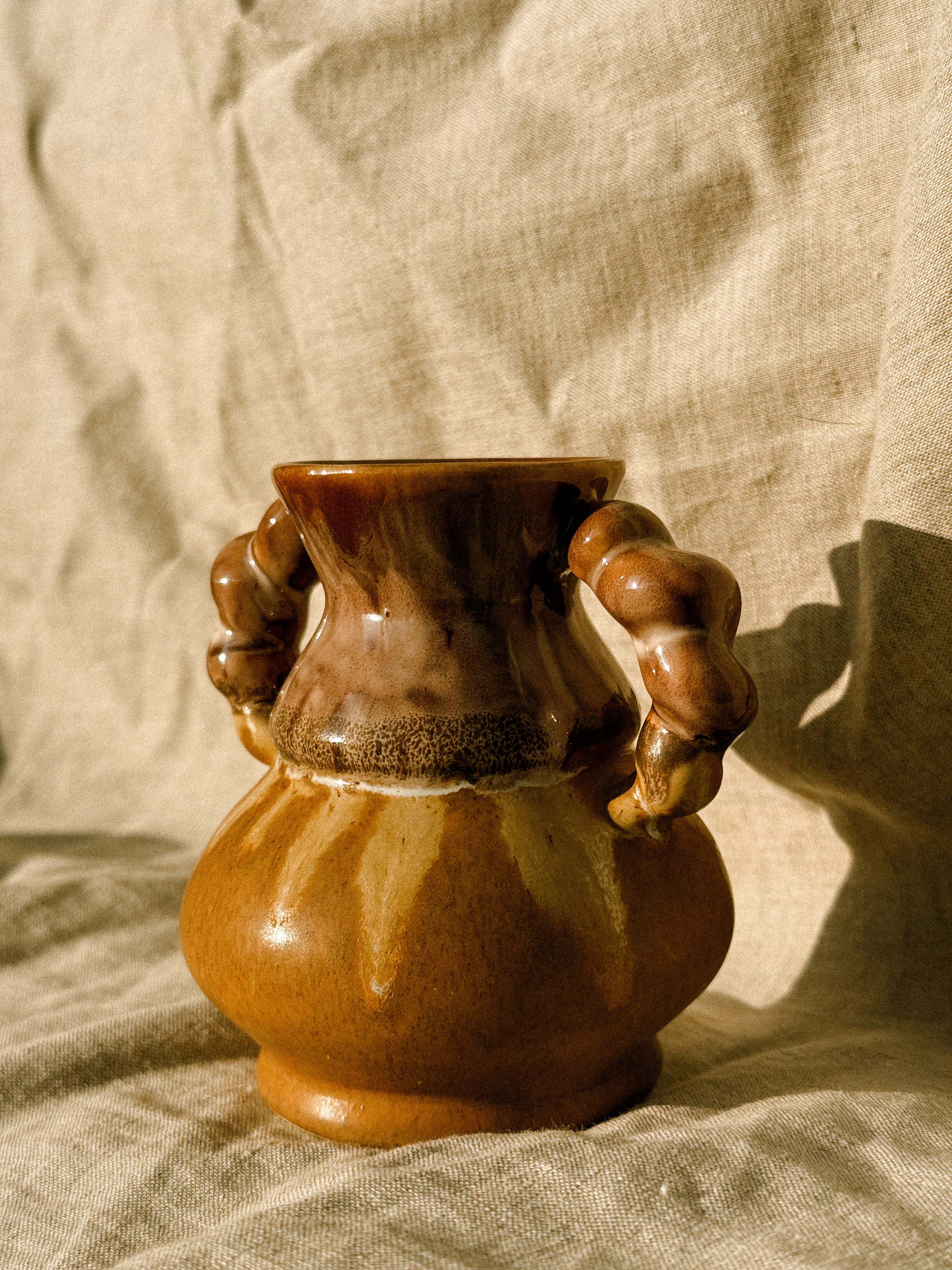 HN033 | “Val-André” stoneware jug with sculptural handles, 1970