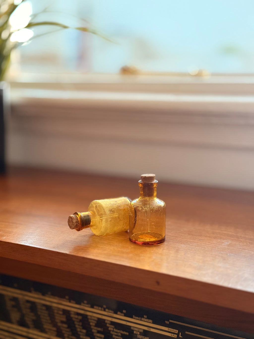 Pair of amber glass dropper jars, 1940s–60s